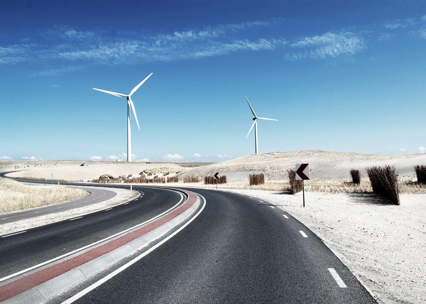 Wind turbines on a coastal road